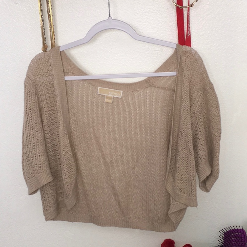 A tan little sweater